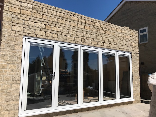 swing and slide door with white frame